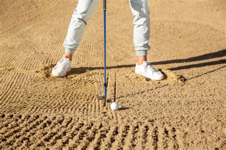 Can you take practice swing in bunker?